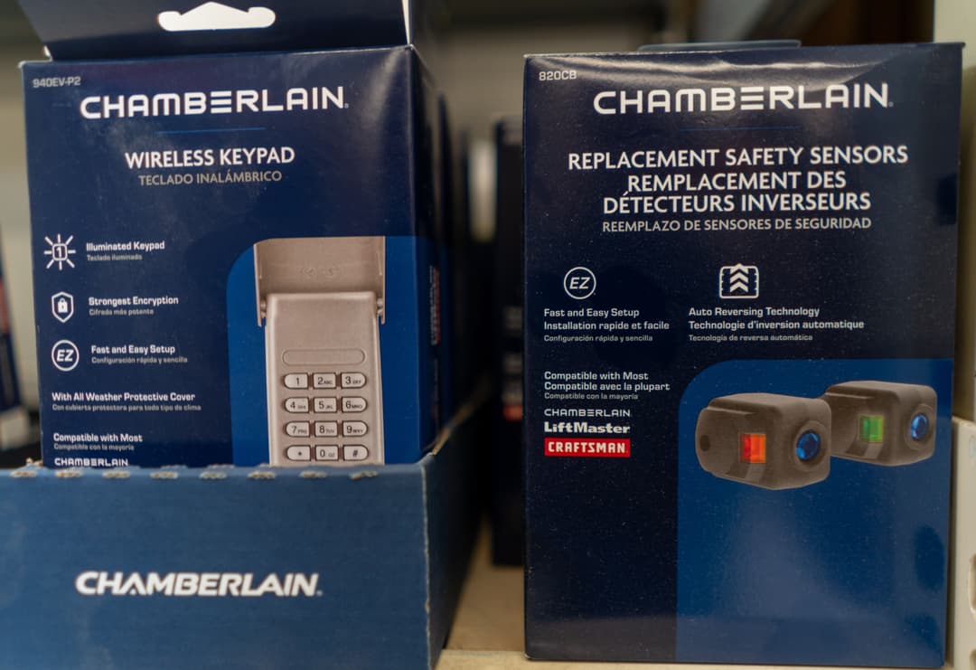 Chamberlain wireless keypad and replacement safety sensors on display in a store.