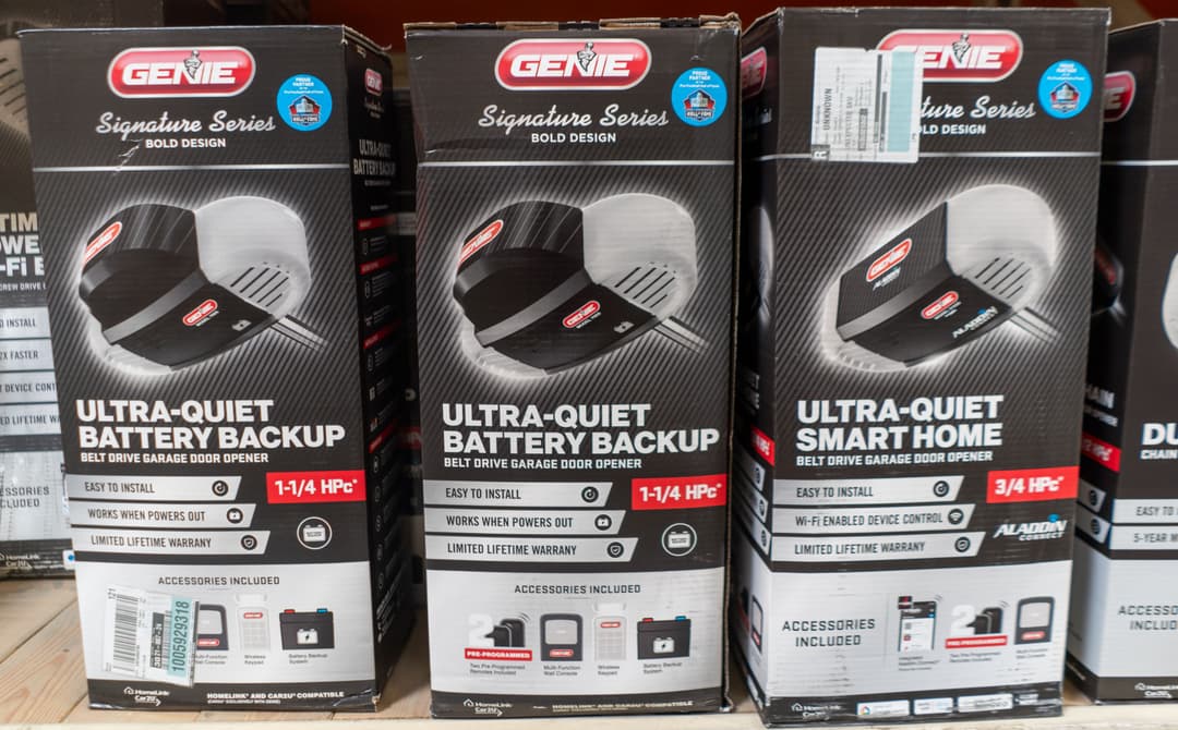 Genie garage door openers: Ultra-Quiet battery backup and smart home models in retail display.